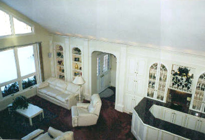 White painted built-in bookcases and cabinetry in a living room built by Kitchen-Works