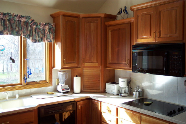 Semi-custom cherry cabinetry and corner storage in a Western Massachusetts kitchen